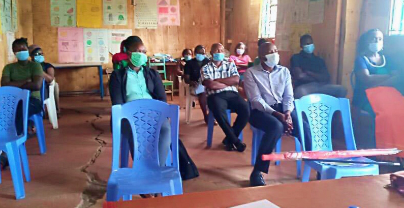 Parents in a classroom wearing masks